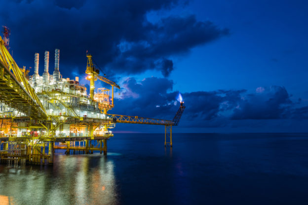 Panorama of oil and gas central processing platform in sun set